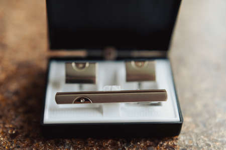 groom's cufflinks in a box