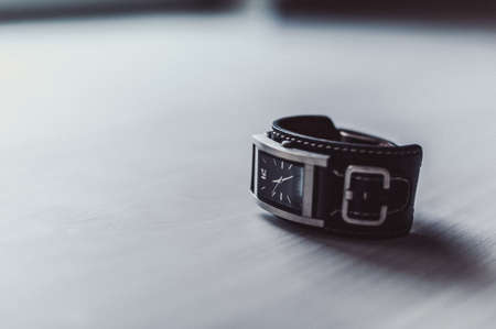Minimalist wristwatch black dial on white backgroundの写真素材