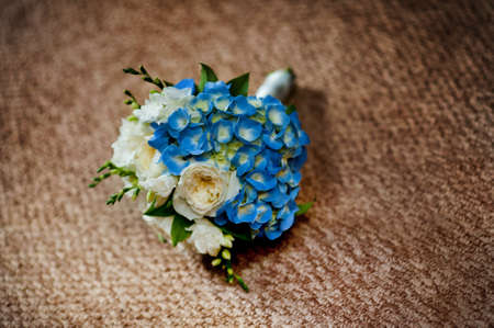 Beautiful bouquet of the bride in different color tones