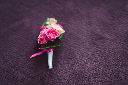 wedding boutonniere on a vintage wooden table.の写真素材
