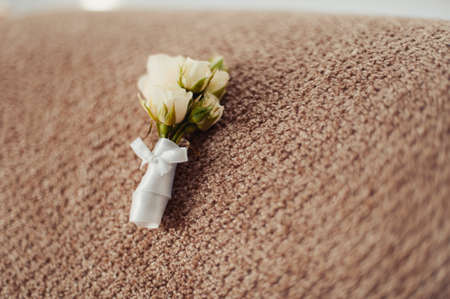 wedding boutonniere on a vintage wooden table.の写真素材