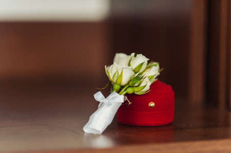 wedding boutonniere on a vintage wooden table.の写真素材