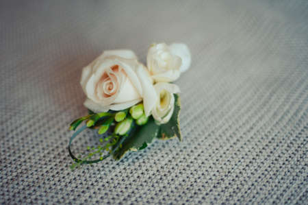 wedding boutonniere on a vintage wooden table.の写真素材