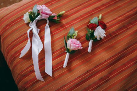 wedding boutonniere on a vintage wooden table.の写真素材