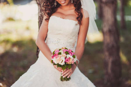 Bride holding big wedding bouquet on wedding ceremonyの写真素材