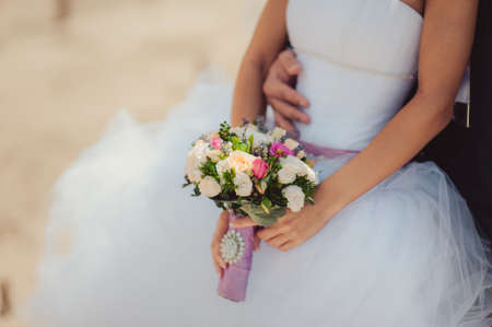 Bride holding big wedding bouquet on wedding ceremonyの写真素材
