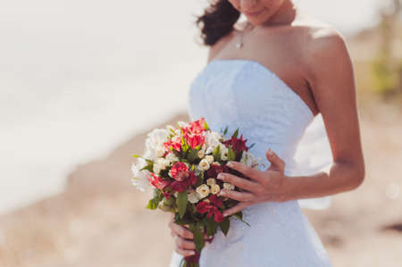 Bride holding big wedding bouquet on wedding ceremonyの写真素材