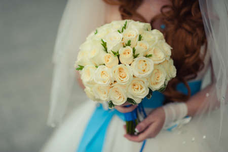 Bride holding big wedding bouquet on wedding ceremonyの写真素材