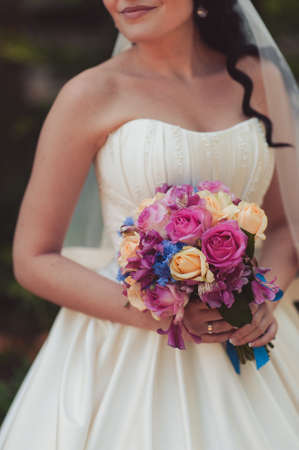 Bride holding big wedding bouquet on wedding ceremonyの写真素材