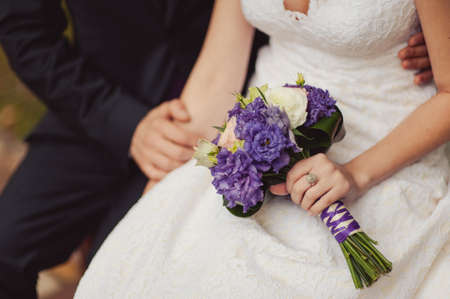 Bride holding big wedding bouquet on wedding ceremonyの写真素材