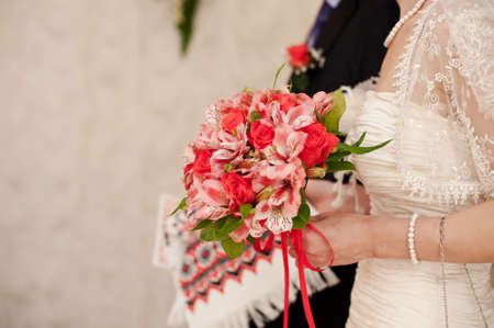 Bride holding big wedding bouquet on wedding ceremonyの写真素材
