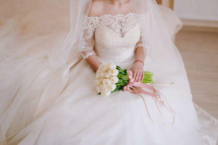 Bride holding big wedding bouquet on wedding ceremonyの写真素材