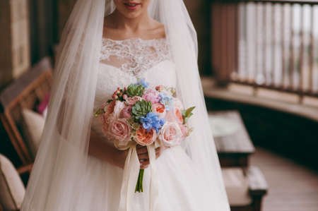 Bride holding big wedding bouquet on wedding ceremonyの写真素材