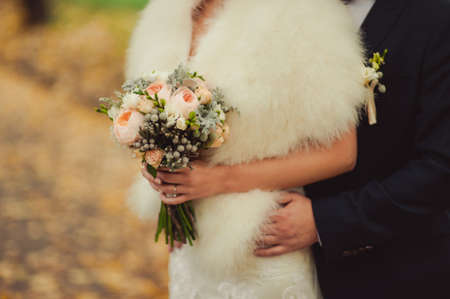 Bride holding big wedding bouquet on wedding ceremonyの写真素材