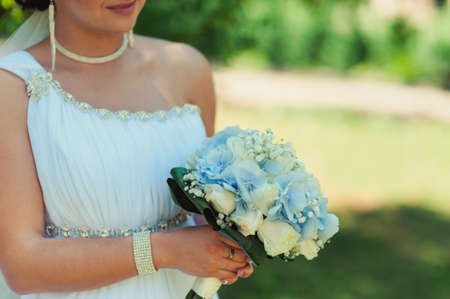 Bride holding big wedding bouquet on wedding ceremonyの写真素材
