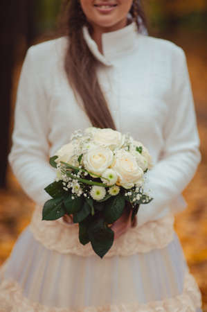 Bride holding big wedding bouquet on wedding ceremonyの写真素材