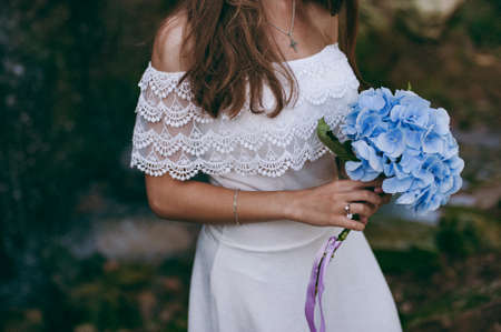 Bride holding big wedding bouquet on wedding ceremonyの写真素材