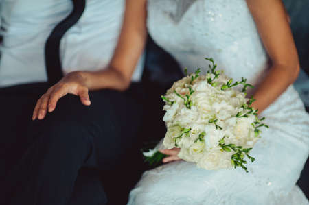 Bride holding big wedding bouquet on wedding ceremonyの写真素材