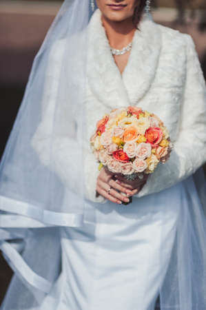 Bride holding big wedding bouquet on wedding ceremonyの写真素材