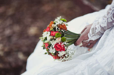 Bride holding big wedding bouquet on wedding ceremonyの写真素材