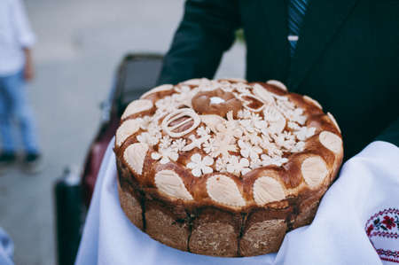 Wedding loaf. Embroidered towel. Bread loam