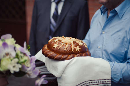 Wedding loaf. Embroidered towel. Bread loamの写真素材