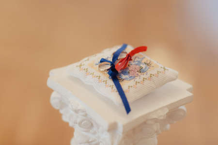 Two wedding rings on the pillowの写真素材