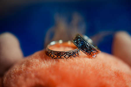 Two wedding rings of the bride and groom close-upの写真素材