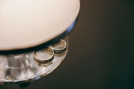 Two wedding rings of the bride and groom close-upの写真素材