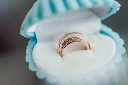 Two wedding rings of the bride and groom close-upの写真素材
