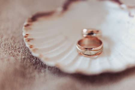 Two wedding rings of the bride and groom close-upの写真素材