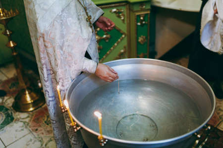 Baptismal ceremony. Altar church bible candles crown cross iconの写真素材