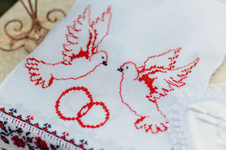 The couple is standing on an embroidered towelの写真素材