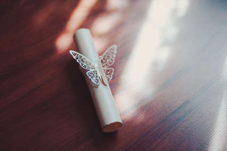 Artificial white butterfly on a dark backgroundの写真素材