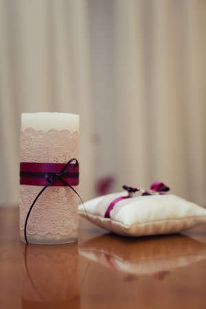 the bride and groom lighting candle at weddingの写真素材