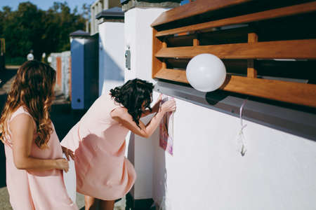 The beautiful bridesmaids and white balloons at weddingの写真素材