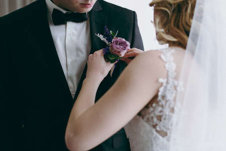 wedding boutonniere with natural flowers on a jacketの写真素材