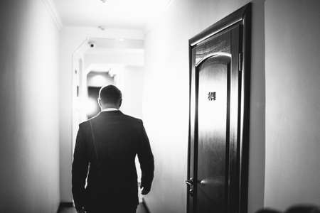 The handsome groom walking along