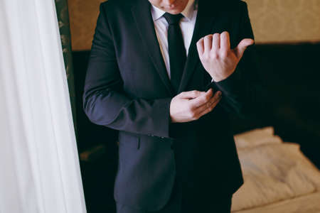 A man dresses a jacket of black, blue, gray and colorの写真素材