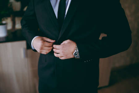 A man dresses a jacket of black, blue, gray and colorの写真素材