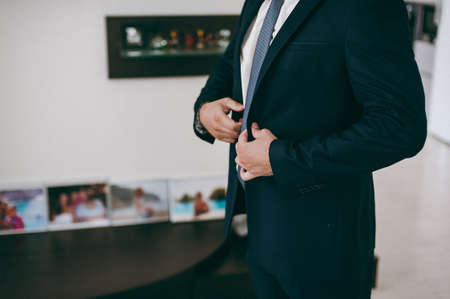 A man dresses a jacket of black, blue, gray and colorの写真素材