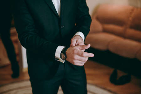 A man dresses a jacket of black, blue, gray and colorの写真素材