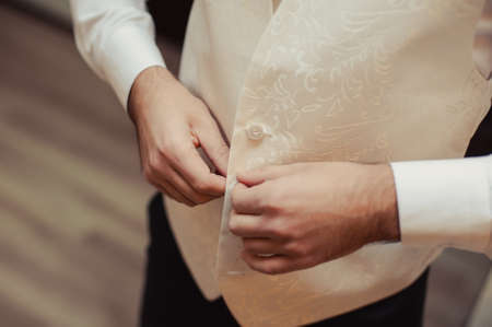 A man dresses a jacket of black, blue, gray and colorの写真素材