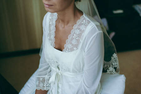 Bride in the dressing gown. beautiful bride in a morningの写真素材
