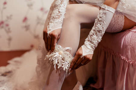 bride puts on the garterの写真素材