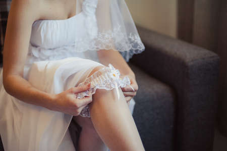bride puts on the garterの写真素材