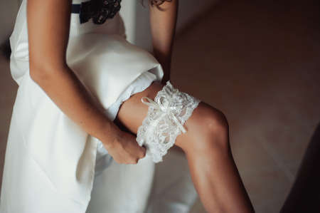 bride puts on the garterの写真素材