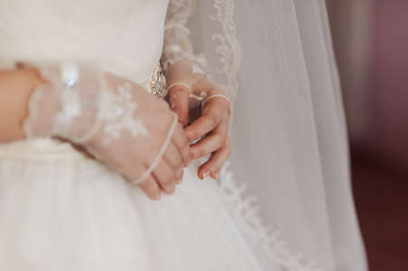 arms and legHands and feet of the bride. Close-ups, hands together, fingerssの写真素材