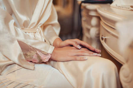 arms and legHands and feet of the bride. Close-ups, hands together, fingerssの写真素材