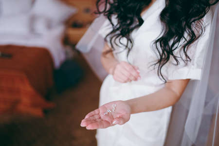 arms and legHands and feet of the bride. Close-ups, hands together, fingerssの写真素材